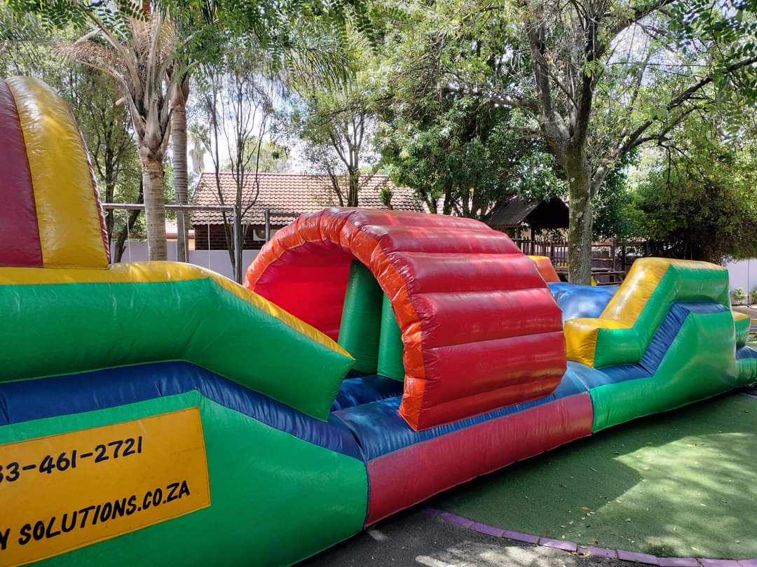 A colourful inflatable obstacle course set up in the Kosi Kasi play area